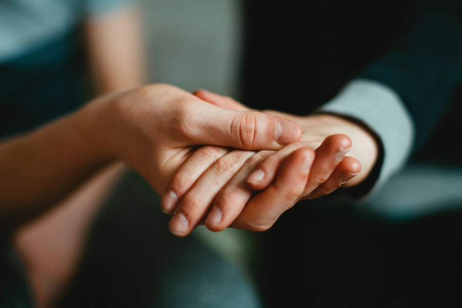 Assistance Person holding a helping hand