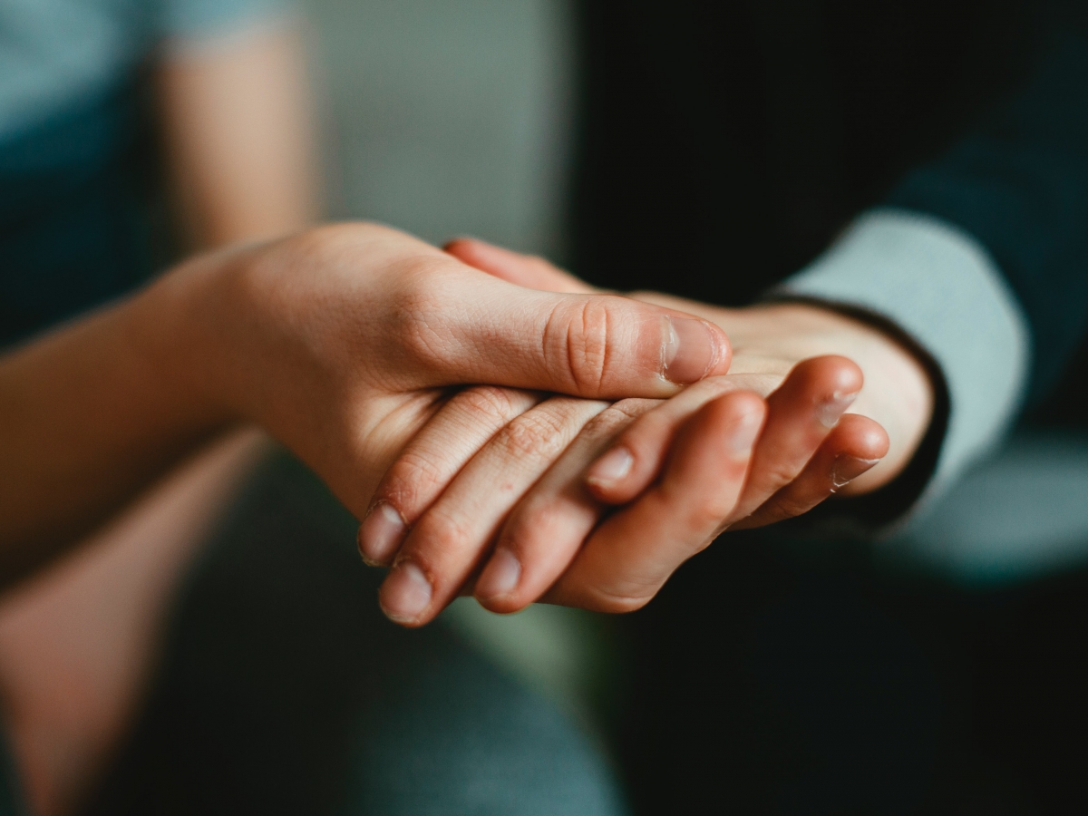 Assistance Person holding a helping hand